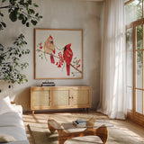 Winterberry Tidings I by Yvette St. Amant. Shown in a natural wood frame in a cozy modern living room. Available as an archival giclee rolled canvas, fine art paper, or poster print. SKU 101222a.